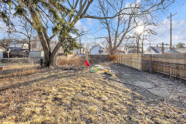 view of yard with a fenced backyard