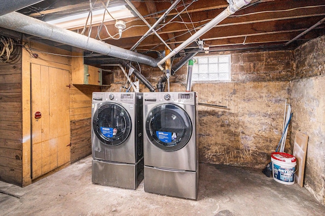 washroom featuring laundry area and washer and dryer