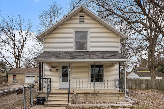 view of front facade featuring a garage, a shingled roof, covered porch, fence, and an outdoor structure