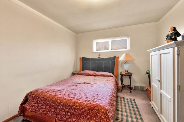 carpeted bedroom featuring visible vents, crown molding, and baseboards