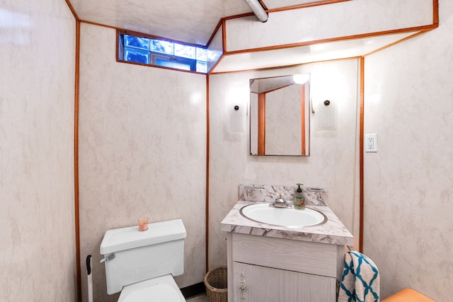 half bath with vanity and toilet