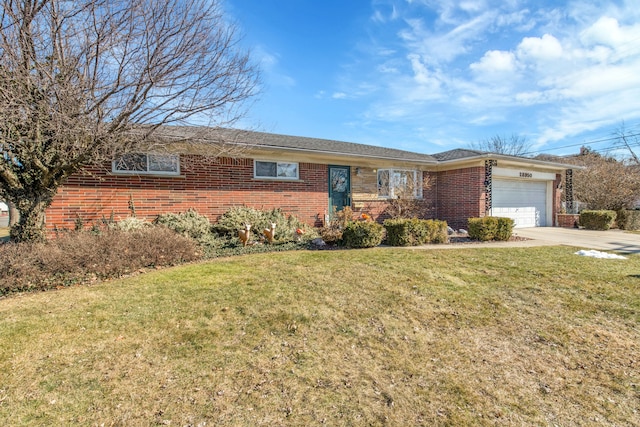 single story home featuring a garage, a front yard, concrete driveway, and brick siding