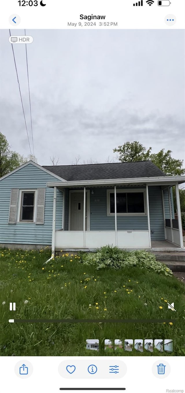 1531 Gilbert St, Saginaw, MI 48602 - view of front of property with covered porch and a front lawn