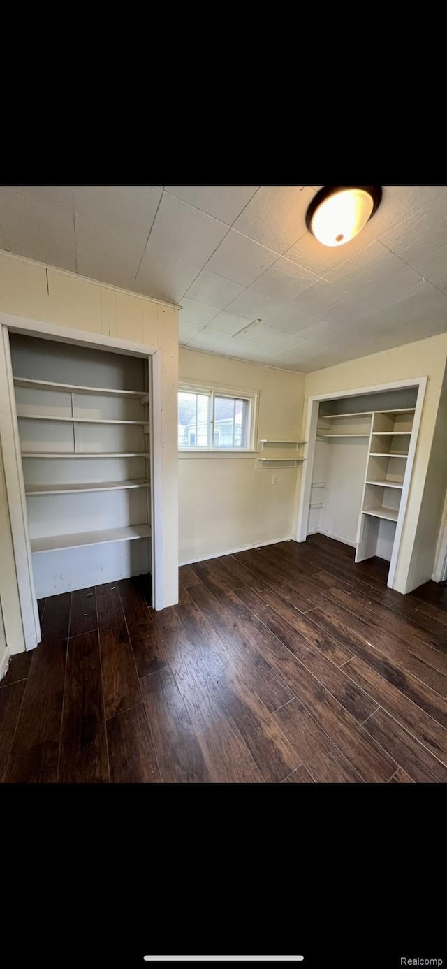 1531 Gilbert St, Saginaw, MI 48602 - unfurnished bedroom with dark wood-type flooring