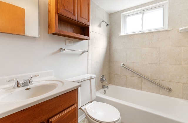 bathroom with toilet, vanity, and shower / bathing tub combination