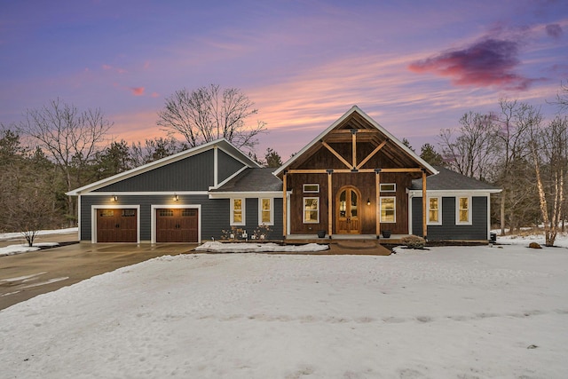 view of front of property featuring driveway and an attached garage