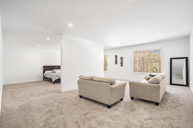 living room featuring light carpet, baseboards, and recessed lighting