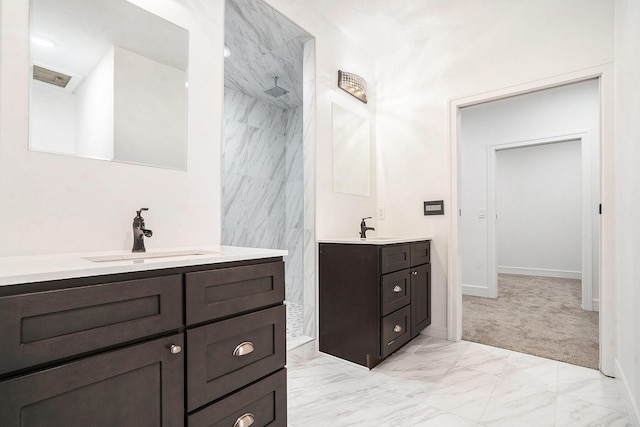 full bath with two vanities, a sink, visible vents, marble finish floor, and walk in shower