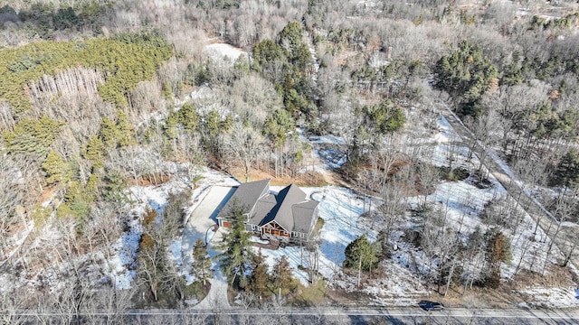 bird's eye view with a wooded view