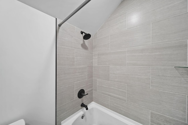 7450 Sears Rd, Horton, MI 49246 - full bath featuring vaulted ceiling, bathing tub / shower combination, and toilet