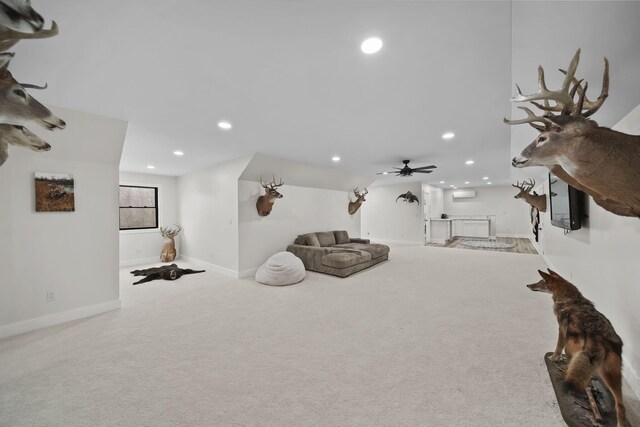7450 Sears Rd, Horton, MI 49246 - interior space featuring a wall unit AC, carpet, baseboards, and recessed lighting
