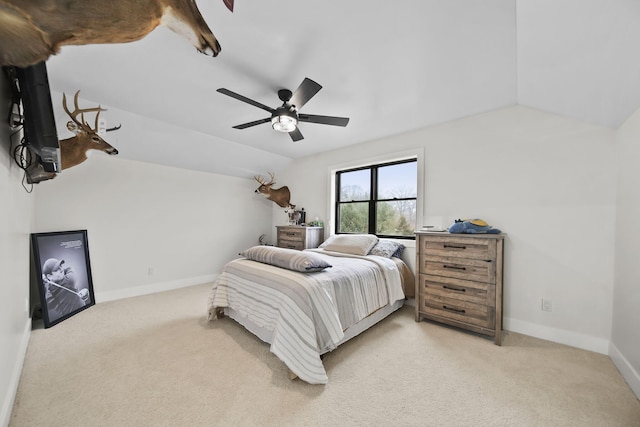 7450 Sears Rd, Horton, MI 49246 - bedroom with a ceiling fan, lofted ceiling, light colored carpet, and baseboards
