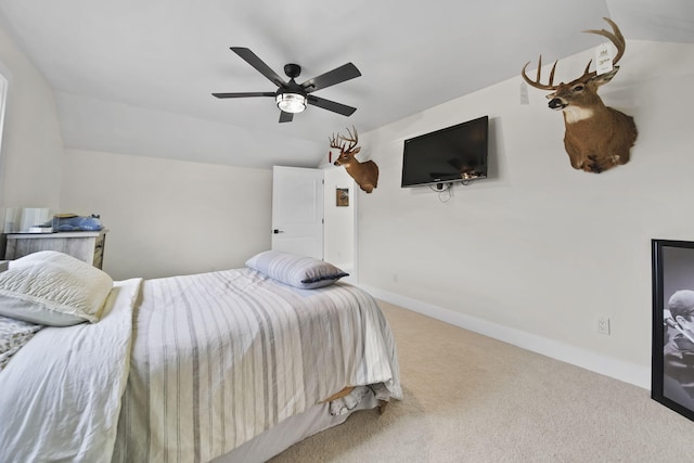 7450 Sears Rd, Horton, MI 49246 - carpeted bedroom featuring lofted ceiling, a ceiling fan, and baseboards