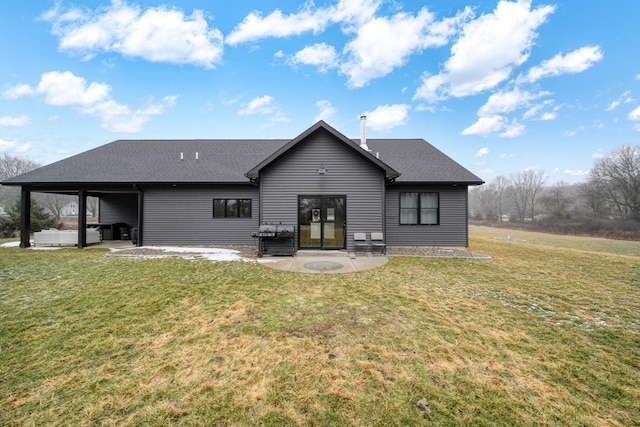 7450 Sears Rd, Horton, MI 49246 - rear view of house with a patio, a shingled roof, and a lawn