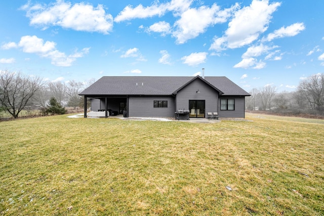 7450 Sears Rd, Horton, MI 49246 - rear view of property featuring a patio and a lawn