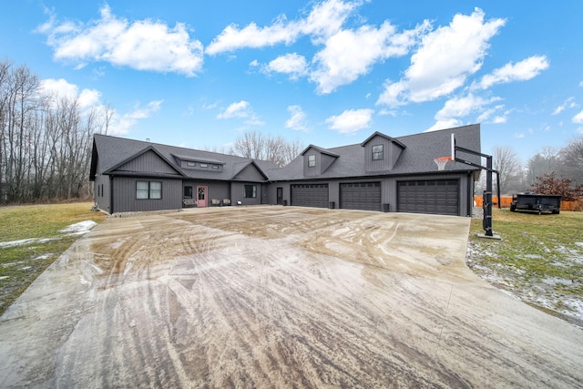 7450 Sears Rd, Horton, MI 49246 - view of front of home featuring a garage, roof with shingles, concrete driveway, and a front yard