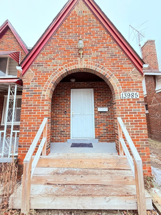 entrance to property with brick siding