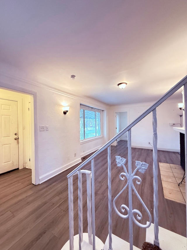 stairs with wood finished floors