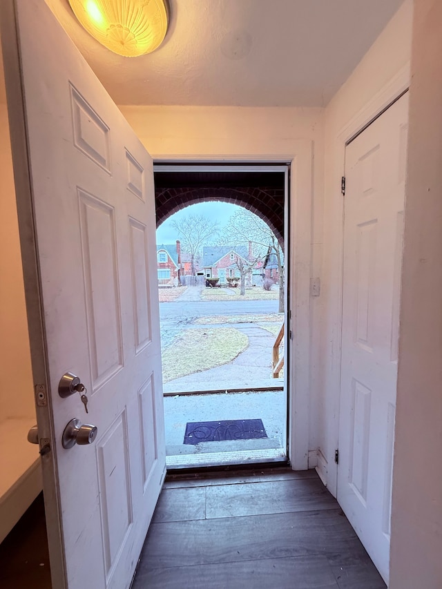 doorway to outside with wood finished floors