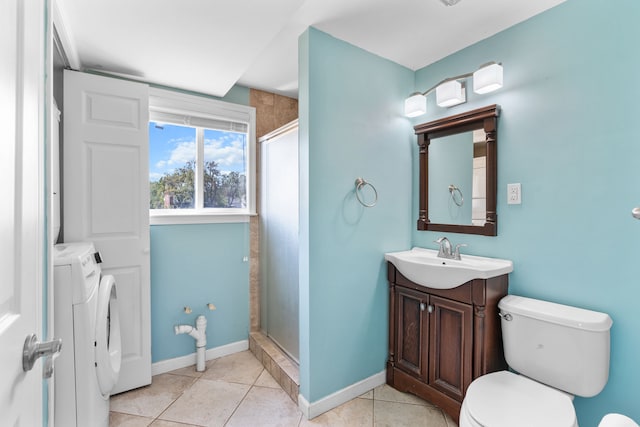 full bath featuring toilet, vanity, independent washer and dryer, a shower stall, and tile patterned floors