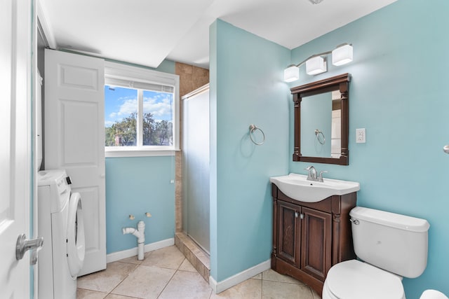 34134 Dequindre Rd, Sterling Heights, MI 48310 - bathroom featuring washing machine and clothes dryer, a shower stall, vanity, tile patterned floors, and toilet