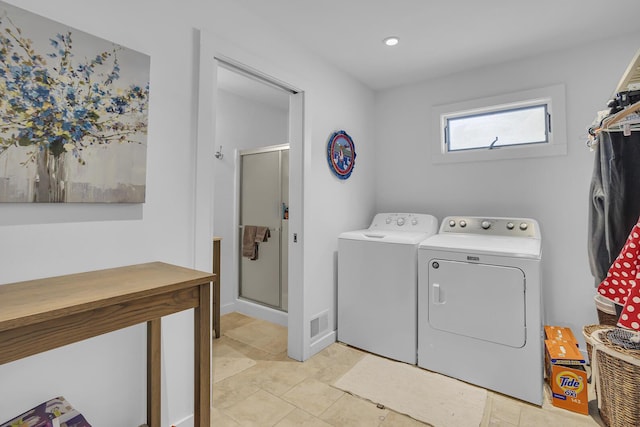 laundry area with laundry area and washer and dryer