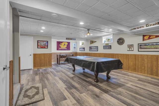 rec room with pool table, wooden walls, wood finished floors, and wainscoting