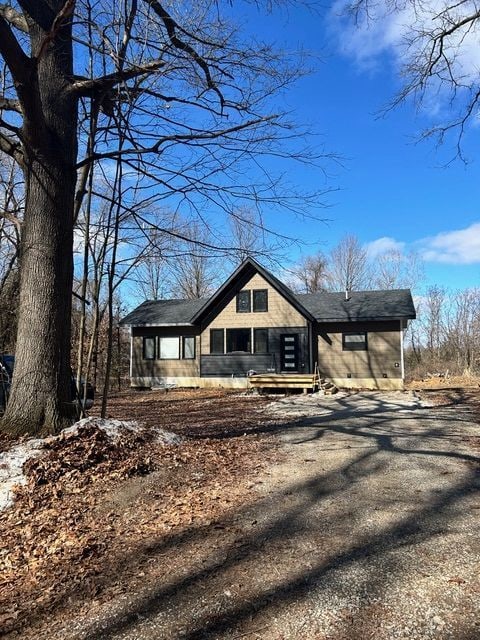 view of front of home featuring crawl space and driveway