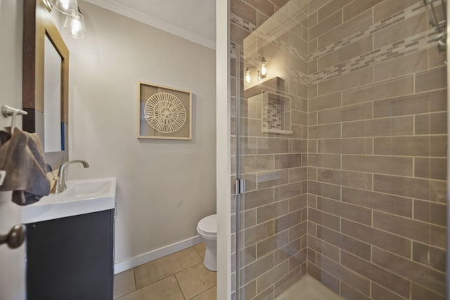 bathroom featuring toilet, ornamental molding, a shower stall, vanity, and tile patterned floors