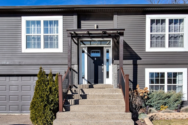 doorway to property featuring a garage