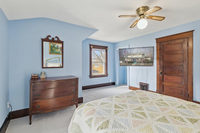 bedroom featuring baseboards, a ceiling fan, and light colored carpet