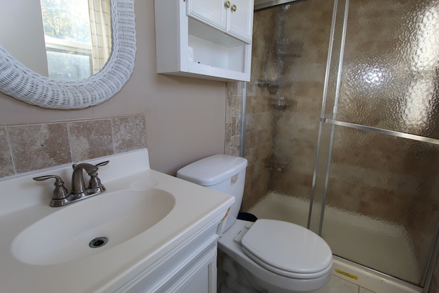 full bath featuring a shower stall, toilet, and vanity