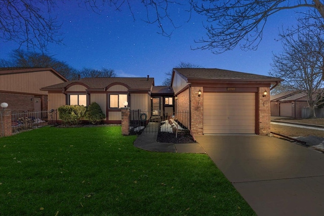 view of front of house with a garage, brick siding, fence, driveway, and a front lawn