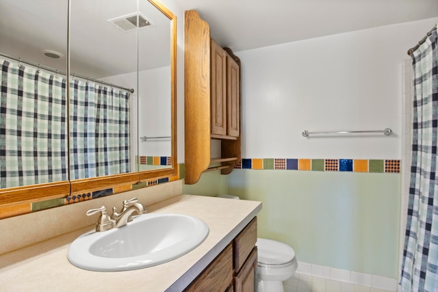 full bathroom with curtained shower, visible vents, toilet, vanity, and tile patterned flooring