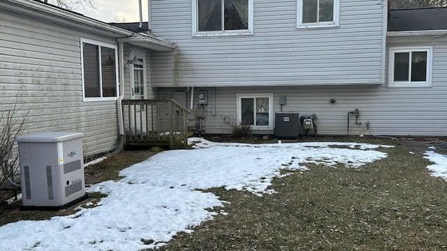 view of snow covered property entrance