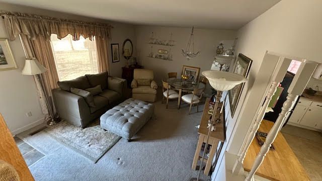 living room featuring baseboards