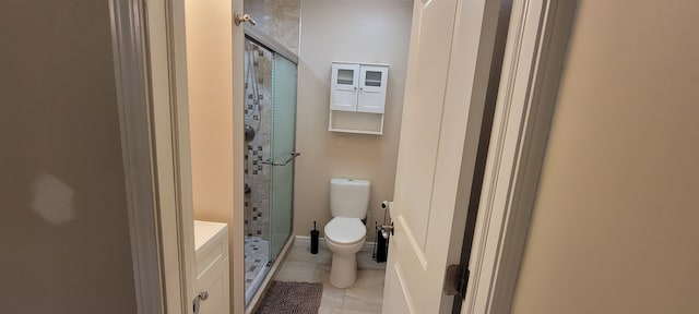 full bathroom with a shower stall, toilet, and tile patterned floors