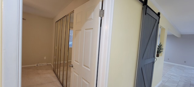 2740 N Lake Angelus Rd, Waterford, MI 48329 - corridor featuring baseboards and a barn door