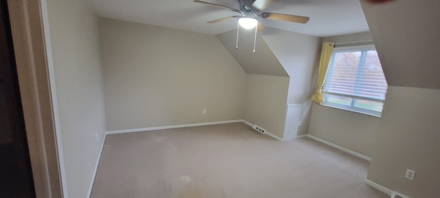 bonus room with carpet, visible vents, vaulted ceiling, ceiling fan, and baseboards