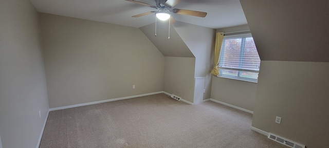 bonus room with visible vents, baseboards, lofted ceiling, ceiling fan, and carpet