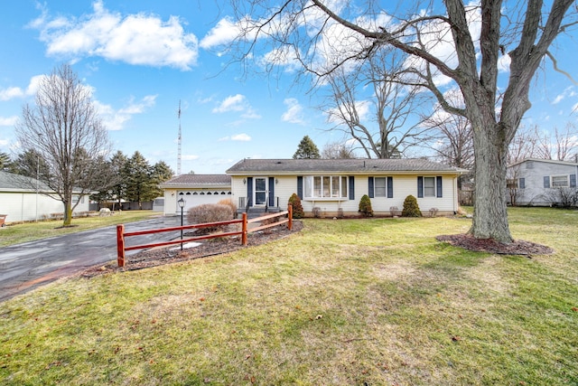 single story home with a garage, aphalt driveway, and a front yard