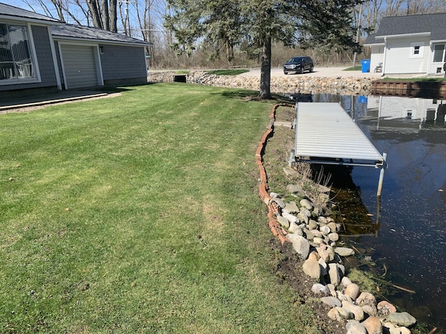 view of yard featuring a boat dock