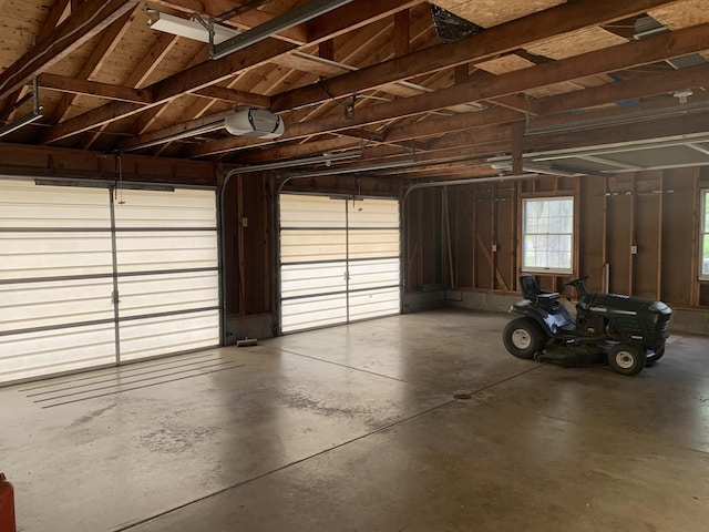 7004 Walnut Hill Rd, Manitou Beach, MI 49253 - garage featuring a garage door opener