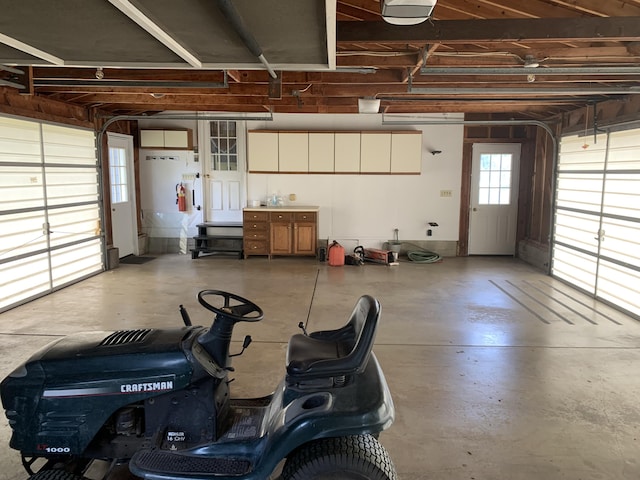 7004 Walnut Hill Rd, Manitou Beach, MI 49253 - garage with a garage door opener