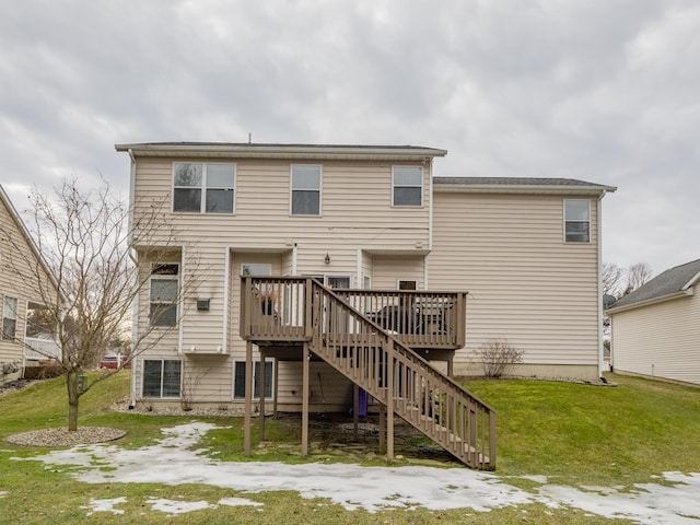 rear view of house featuring stairs, a yard, and a deck