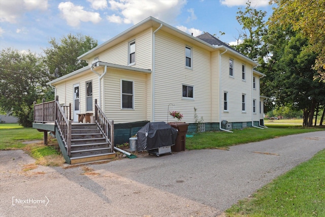 view of home's exterior featuring a yard