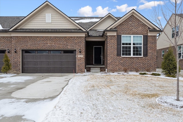 view of front of house featuring driveway, brick siding, an attached garage, and a shingled roof