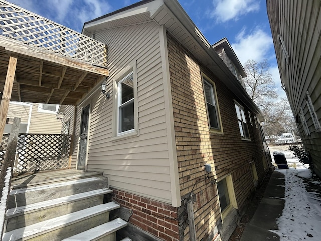 view of property exterior with brick siding