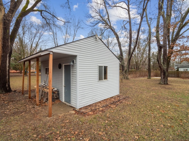 view of outbuilding with fence