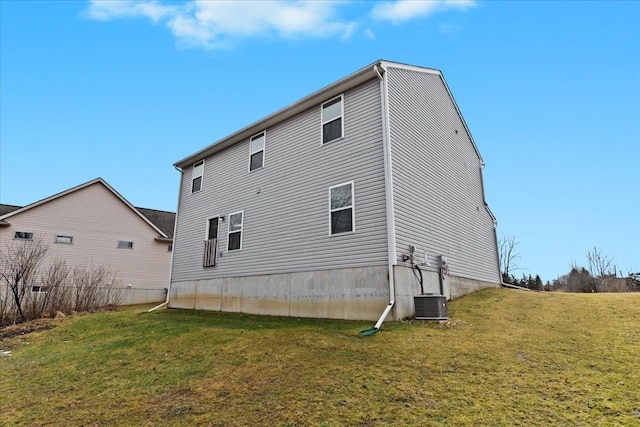 rear view of property featuring a yard